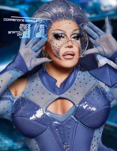 Bust view of Eve6000 wearing a blue space-themed outfit with matching clear moon-shaped mask.